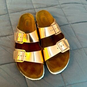 Birkenstock copper sandals.